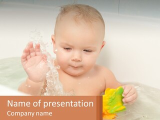 A Baby In A Bathtub Playing With A Yellow Leaf PowerPoint Template