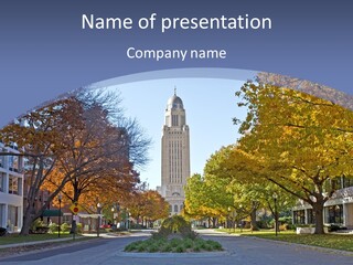 A City Street With A Tall Tower In The Background PowerPoint Template