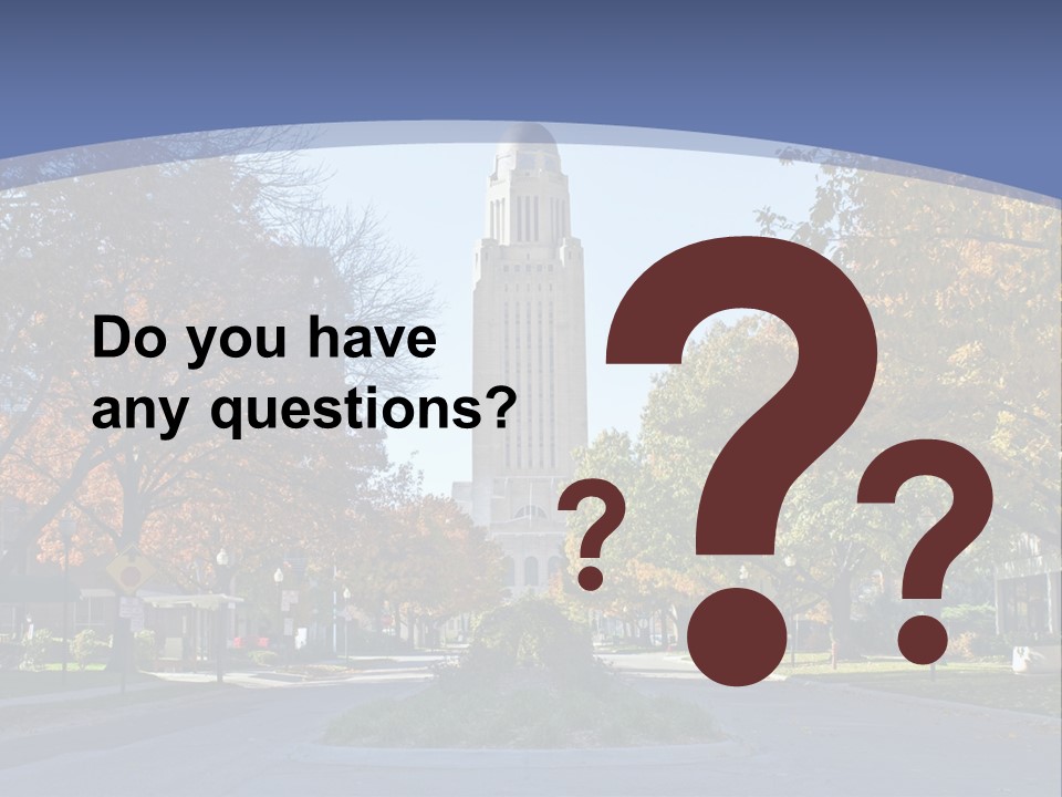 A City Street With A Tall Tower In The Background PowerPoint Template