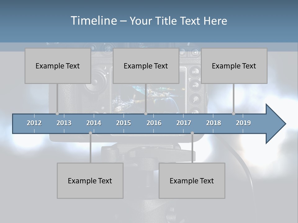 A Video Camera On A Tripod With Blurry Lights In The Background PowerPoint Template