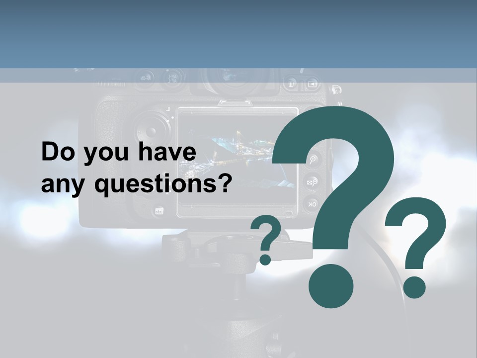 A Video Camera On A Tripod With Blurry Lights In The Background PowerPoint Template