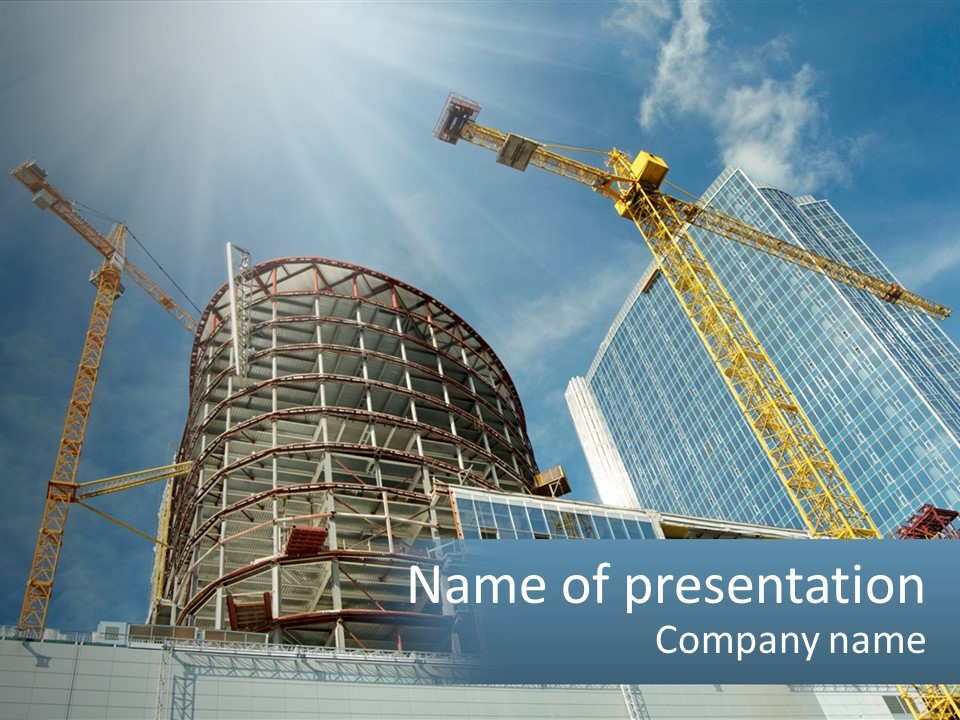 A Group Of Construction Cranes In Front Of A Building PowerPoint Template