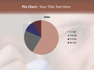 A Man Holding Up A Chip To His Eye PowerPoint Template