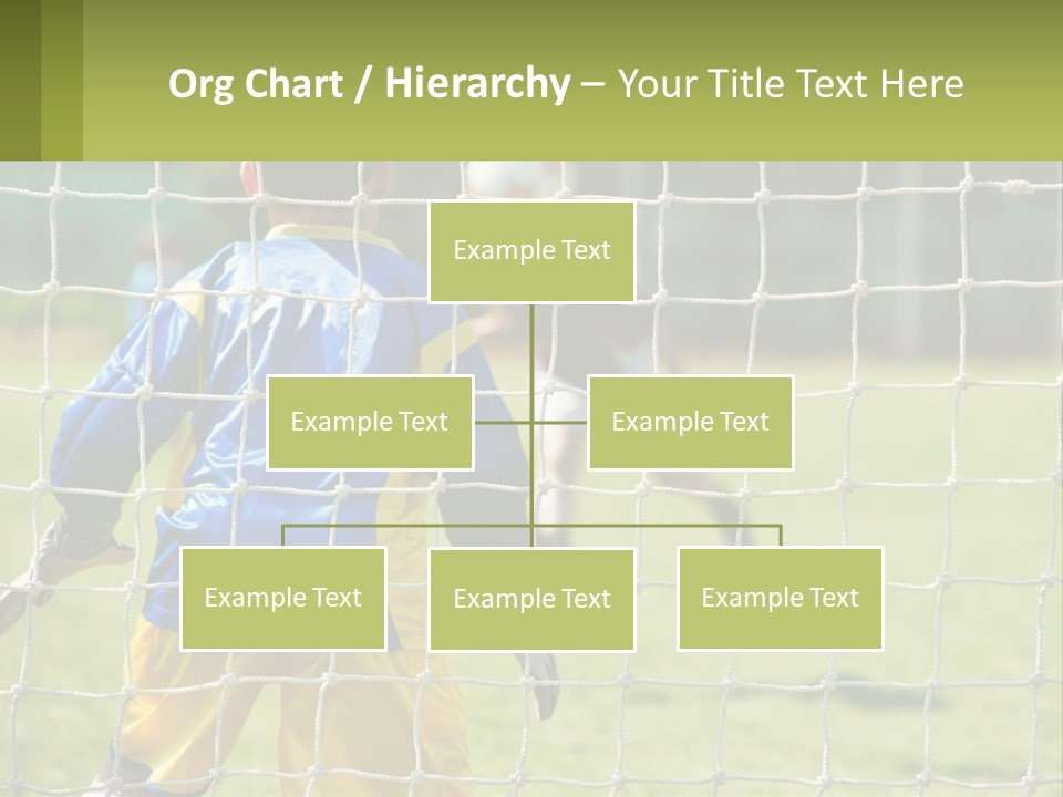 A Young Boy Kicking A Soccer Ball Towards A Goal PowerPoint Template