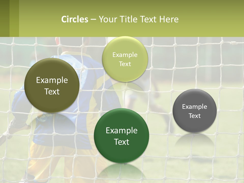 A Young Boy Kicking A Soccer Ball Towards A Goal PowerPoint Template