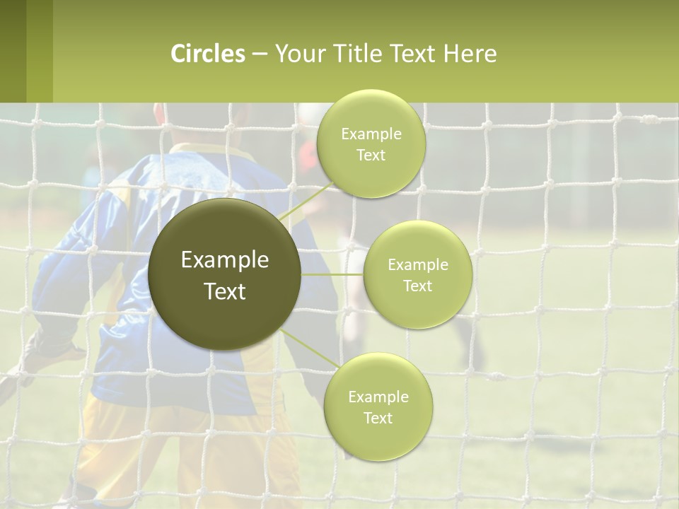 A Young Boy Kicking A Soccer Ball Towards A Goal PowerPoint Template