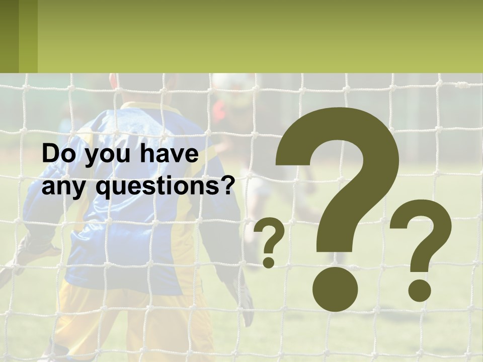 A Young Boy Kicking A Soccer Ball Towards A Goal PowerPoint Template