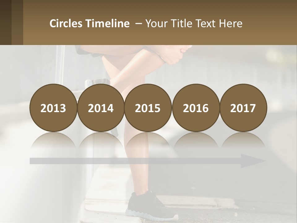 A Person Sitting On A Wall With Their Legs Crossed PowerPoint Template