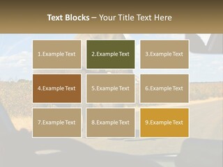 A Large Elephant Walking Across A Street Next To A Car PowerPoint Template