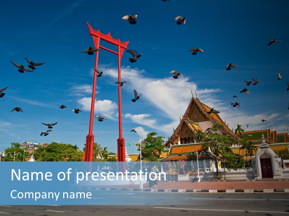 A Large Group Of Birds Flying Over A Building PowerPoint Template