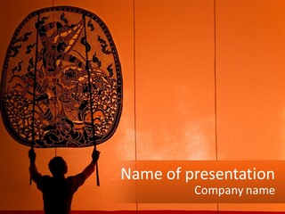 A Man Holding Up A Large Piece Of Art PowerPoint Template
