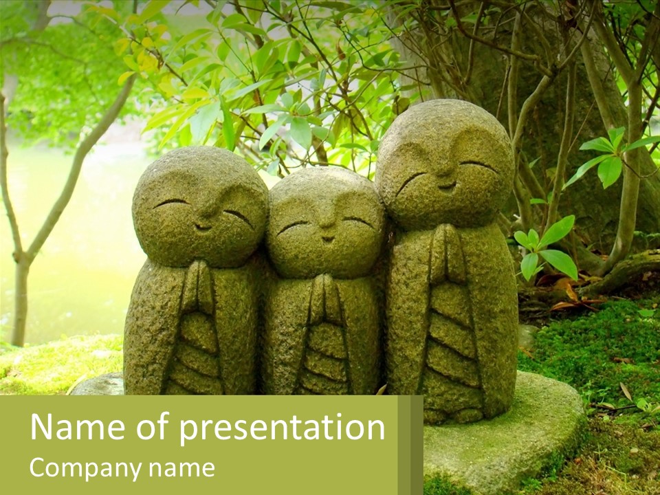 A Group Of Stone Statues Sitting On Top Of A Lush Green Field PowerPoint Template