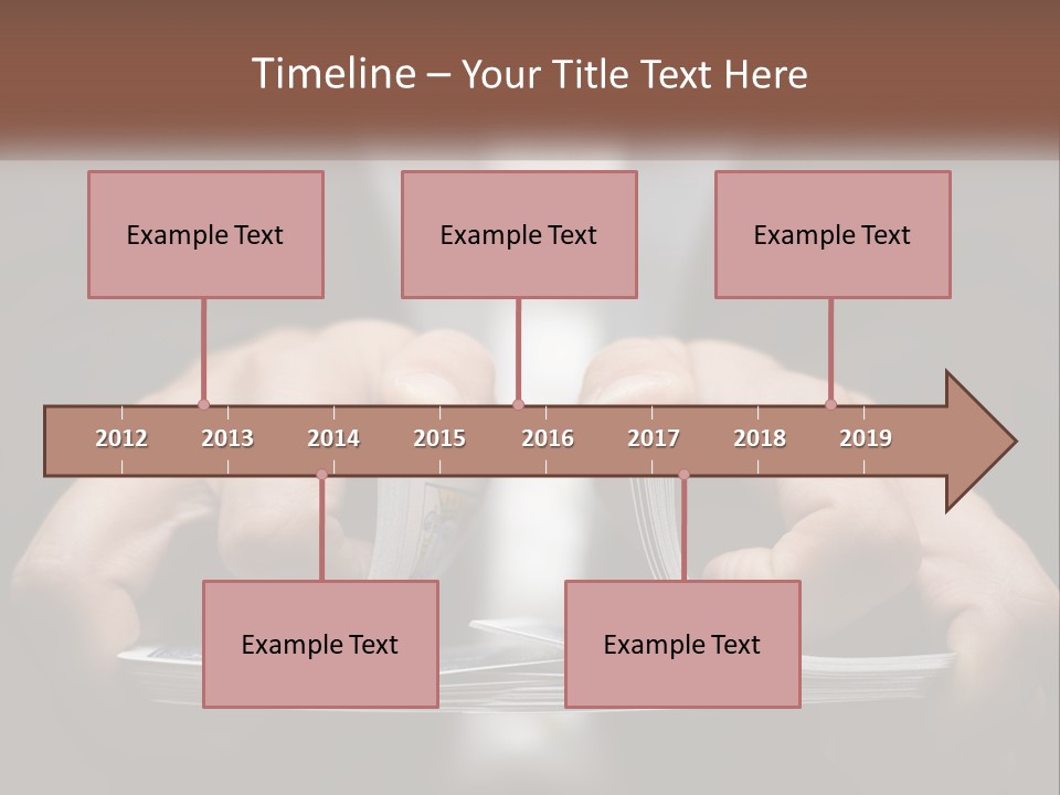 A Person Holding A Piece Of Paper In Their Hands PowerPoint Template