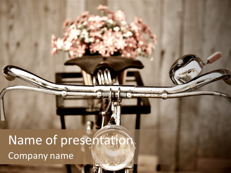 A Close Up Of A Bike Handlebar With Flowers In The Background PowerPoint Template