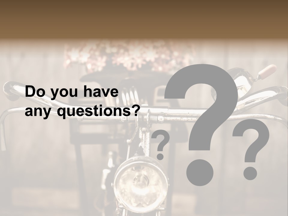 A Close Up Of A Bike Handlebar With Flowers In The Background PowerPoint Template