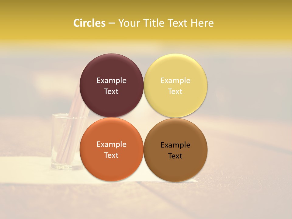 A Table With A Glass And Two Pencils In It PowerPoint Template