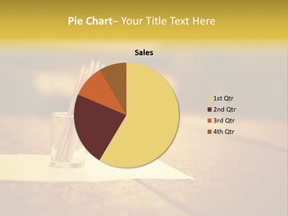 A Table With A Glass And Two Pencils In It PowerPoint Template