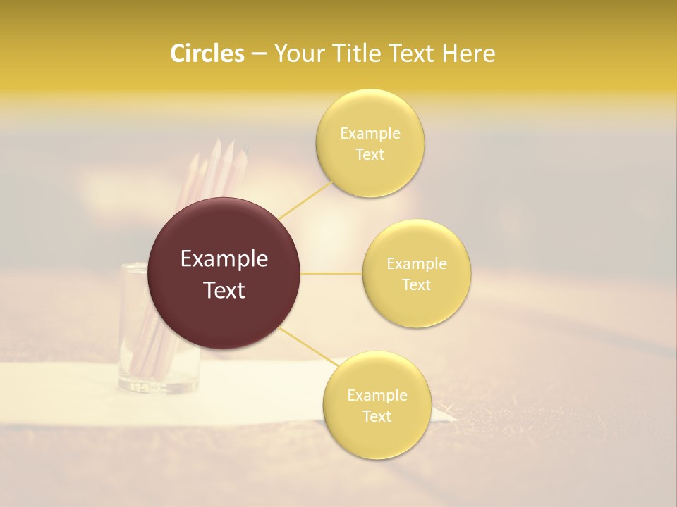 A Table With A Glass And Two Pencils In It PowerPoint Template
