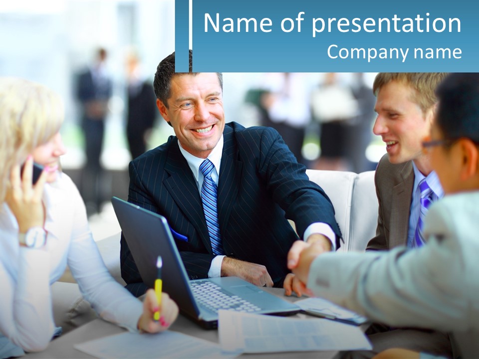 A Group Of People Sitting Around A Table Shaking Hands PowerPoint Template