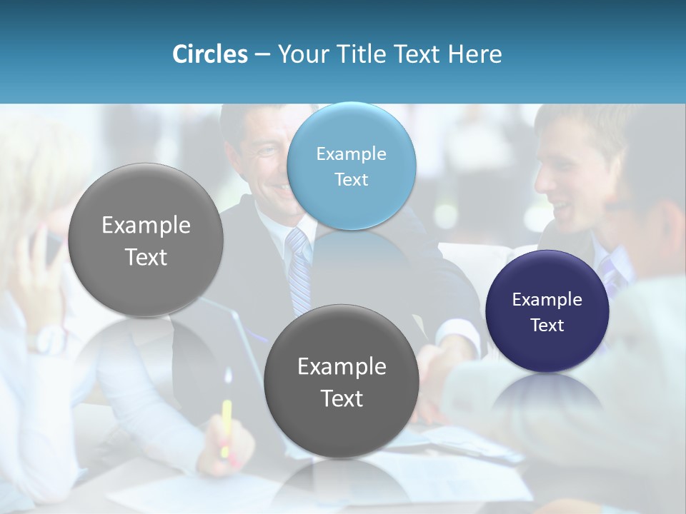 A Group Of People Sitting Around A Table Shaking Hands PowerPoint Template