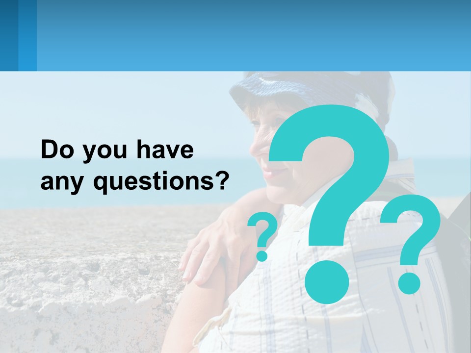 A Woman Sitting On The Beach Wearing A Blue Hat PowerPoint Template