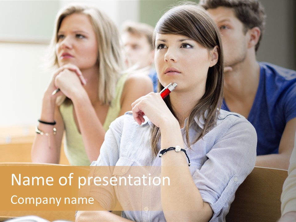 A Group Of People Sitting In A Lecture Hall PowerPoint Template