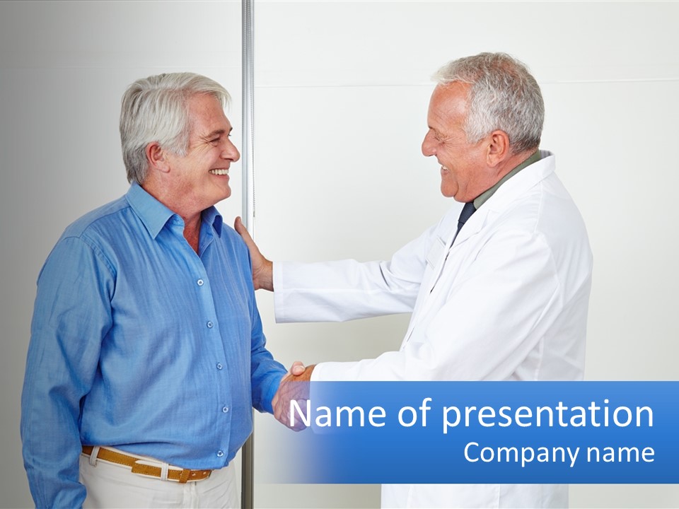 Two Men Shaking Hands In Front Of A White Wall PowerPoint Template