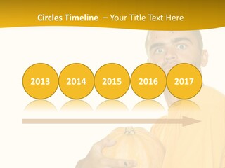 A Man In A Yellow Shirt Holding A Pumpkin PowerPoint Template