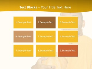 A Man In A Yellow Shirt Holding A Pumpkin PowerPoint Template