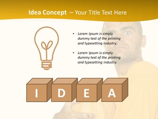 A Man In A Yellow Shirt Holding A Pumpkin PowerPoint Template