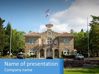 A Large Building With A Flag On Top Of It PowerPoint Template