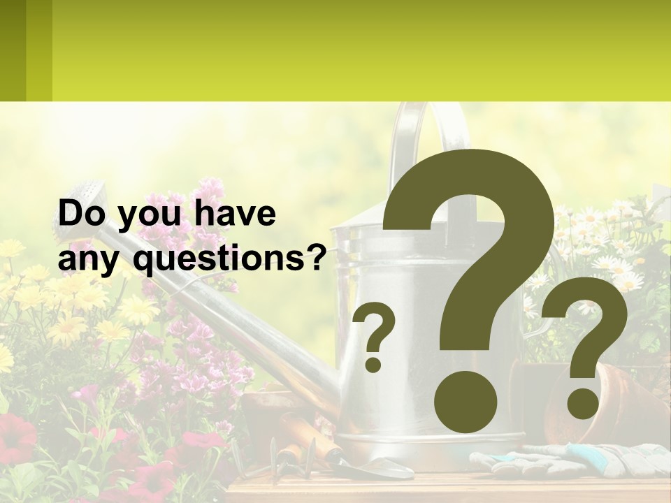 A Watering Can Sitting On A Table Next To Flowers PowerPoint Template