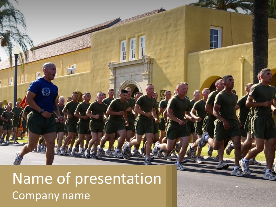 A Large Group Of People Running Down A Street PowerPoint Template