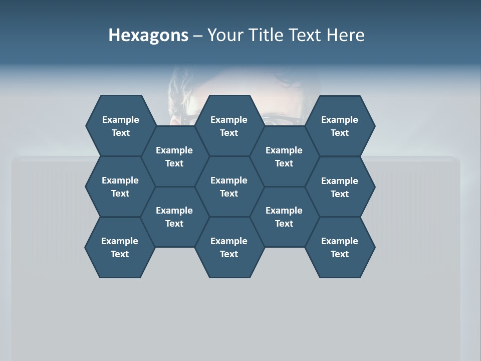 A Man With Glasses Is Looking At A Computer Screen PowerPoint Template