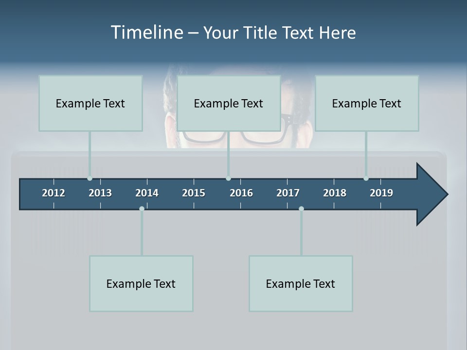 A Man With Glasses Is Looking At A Computer Screen PowerPoint Template