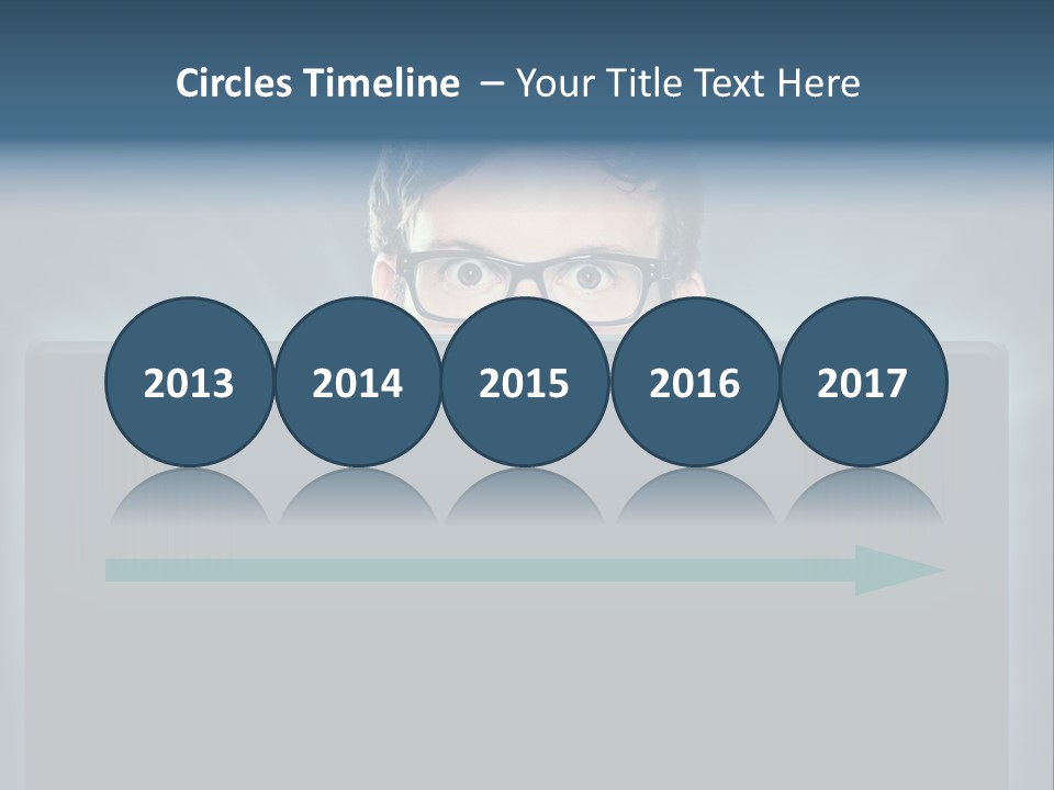 A Man With Glasses Is Looking At A Computer Screen PowerPoint Template