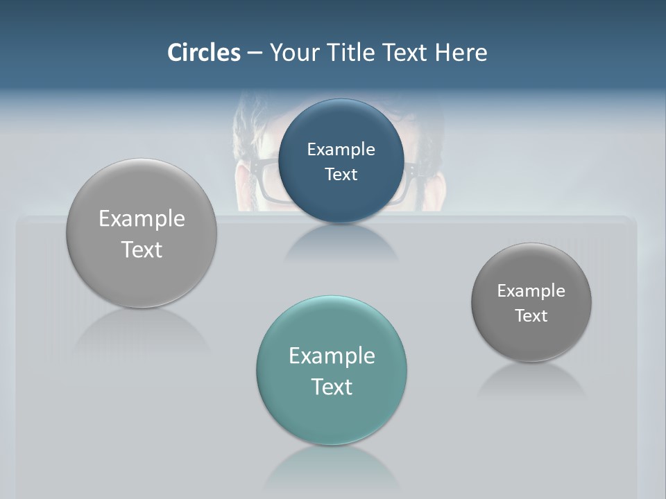 A Man With Glasses Is Looking At A Computer Screen PowerPoint Template