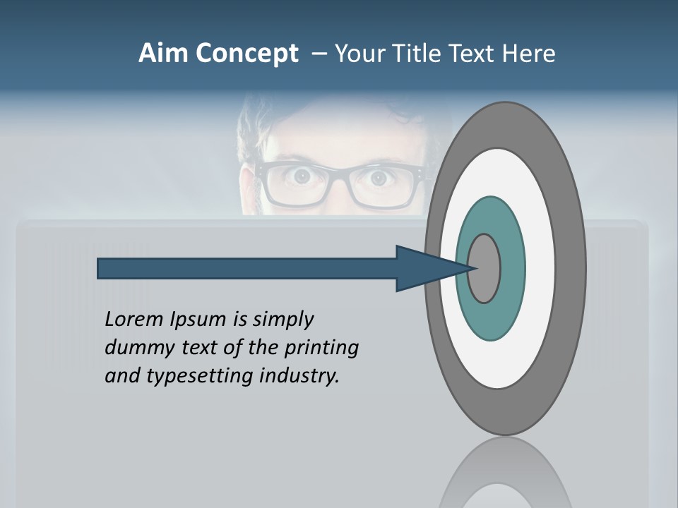 A Man With Glasses Is Looking At A Computer Screen PowerPoint Template