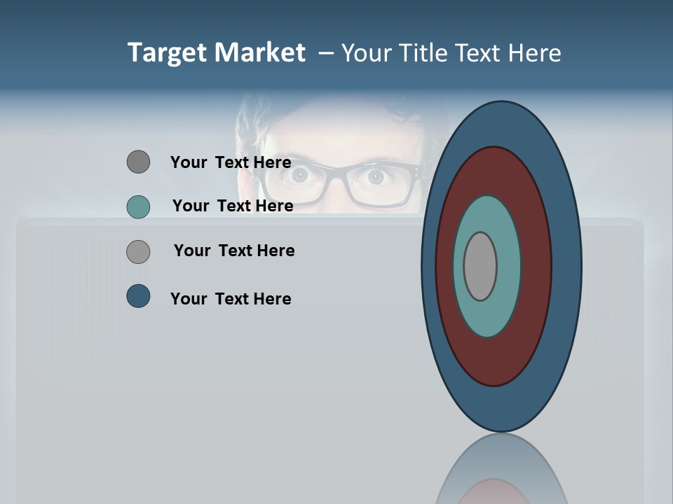 A Man With Glasses Is Looking At A Computer Screen PowerPoint Template