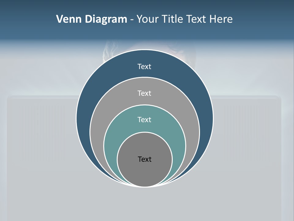 A Man With Glasses Is Looking At A Computer Screen PowerPoint Template