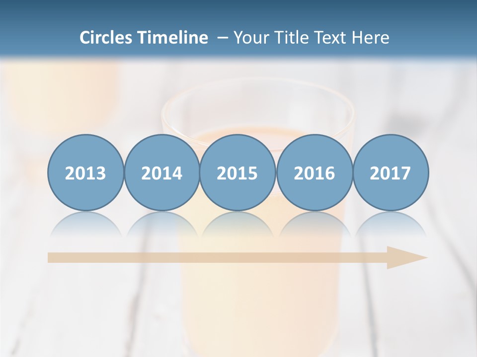 A Glass Of Orange Juice On A Wooden Table PowerPoint Template