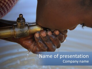 A Person Holding A Water Faucet Over A Body Of Water PowerPoint Template