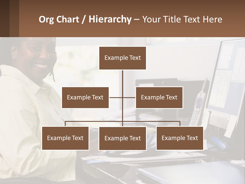 A Woman Sitting At A Desk With A Computer PowerPoint Template