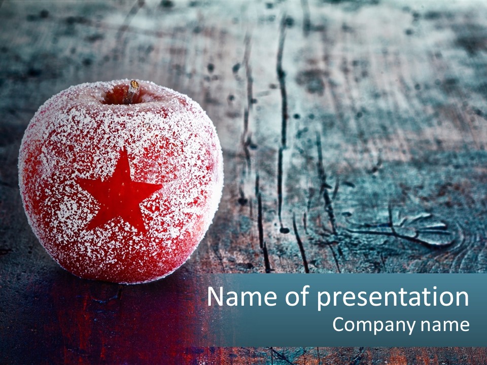 A Red Apple With A Star On It Sitting On A Wooden Table PowerPoint Template
