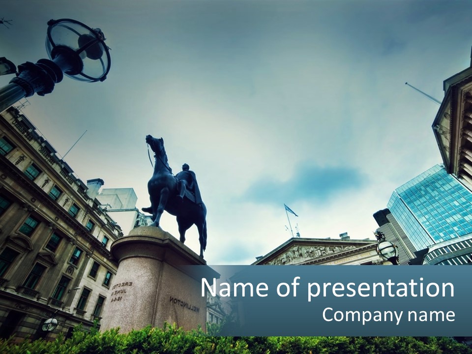 A Statue Of A Man On A Horse In A City PowerPoint Template