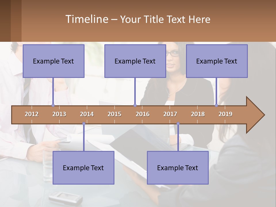A Group Of People Sitting Around A Table With Laptops PowerPoint Template