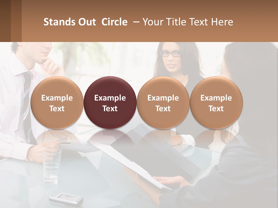 A Group Of People Sitting Around A Table With Laptops PowerPoint Template