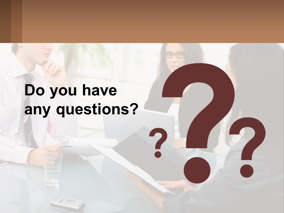 A Group Of People Sitting Around A Table With Laptops PowerPoint Template