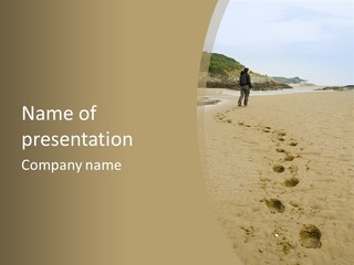 A Person Standing On A Beach With Footprints In The Sand PowerPoint Template