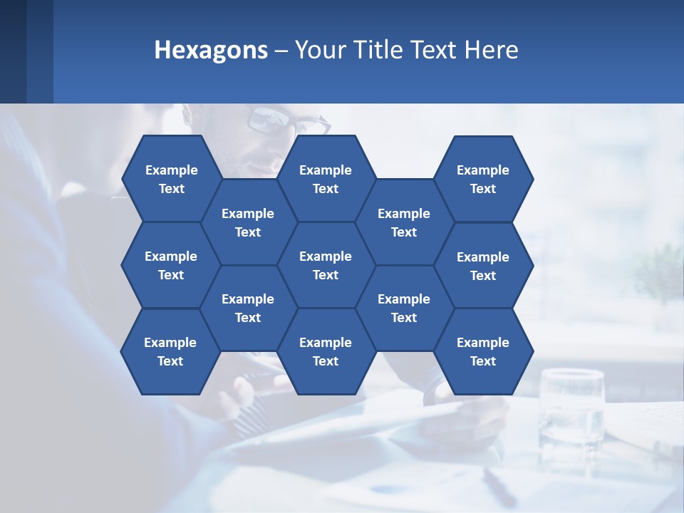 Two Men In Business Suits Sitting At A Table Looking At A Cell Phone PowerPoint Template